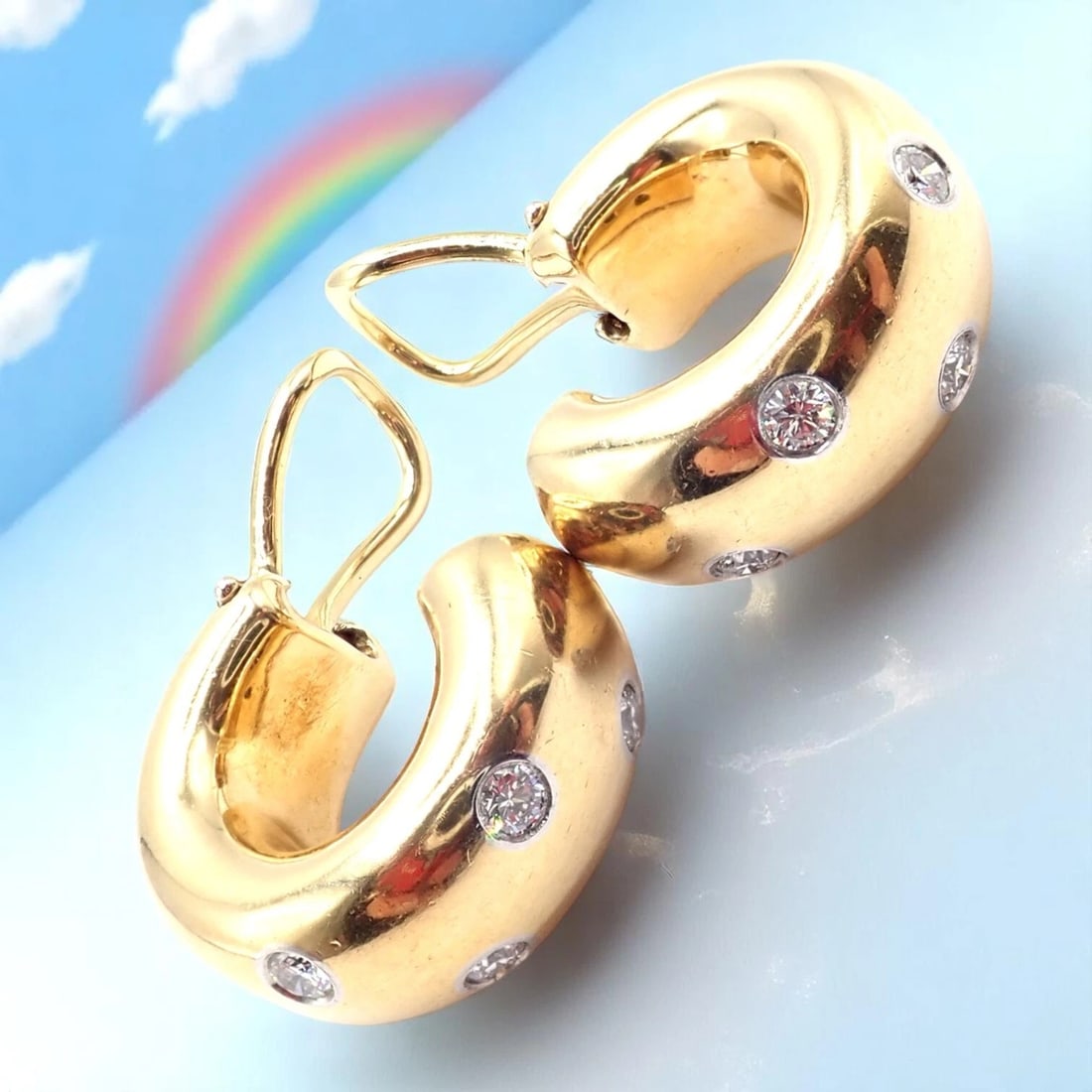 Authentic! Tiffany & Co 18k Yellow Gold Platinum Diamond Etoile Hoop Earrings: Authentic! Tiffany & Co 18k Yellow Gold Platinum Diamond Etoile Hoop Earrings About This Piece: The Tiffany & Co 18k Yellow Gold Platinum Etoile Diamond Hoop Earrings is a luxurious and elegant piece