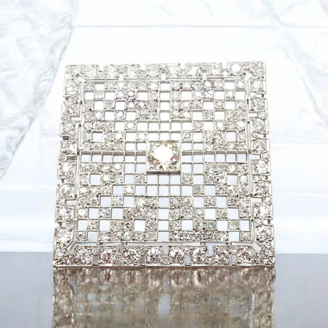 Vintage Estate Art Deco Platinum 5ctw Diamond Square Pin Brooch: Vintage Estate Art Deco Platinum 5ctw Diamond Square Pin Brooch About This Piece: This vintage Art Deco brooch showcases timeless elegance in platinum, adorned with approximately 5 carats total weight