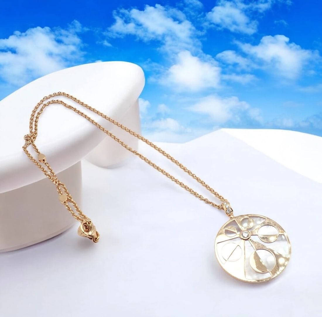 Rare! Bvlgari Bulgari Intarsio 18k Rose Gold Diamond Mother of Pearl Necklace: This rare Bvlgari Intarsio necklace showcases exquisite craftsmanship in 18k rose gold. Featuring a striking round pendant, it highlights intricate mother-of-pearl inlays and dazzling diamond accents.