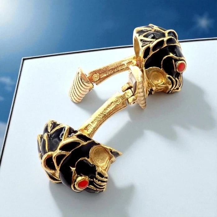 Vintage! David Webb 18k Yellow Gold Black Enamel Lion Cufflinks: These vintage David Webb cufflinks feature bold lion head designs in 18k yellow gold, accented with glossy black enamel and striking red eyes. Showcasing Webb’s signature craftsmanship and drama