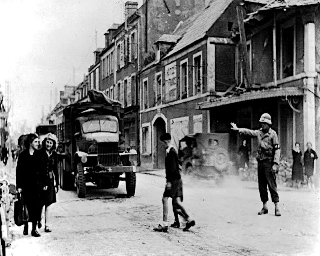 WWII, U.S. MILITARY SAFEGUARDS NORMANDY TOWN (1 of 1)