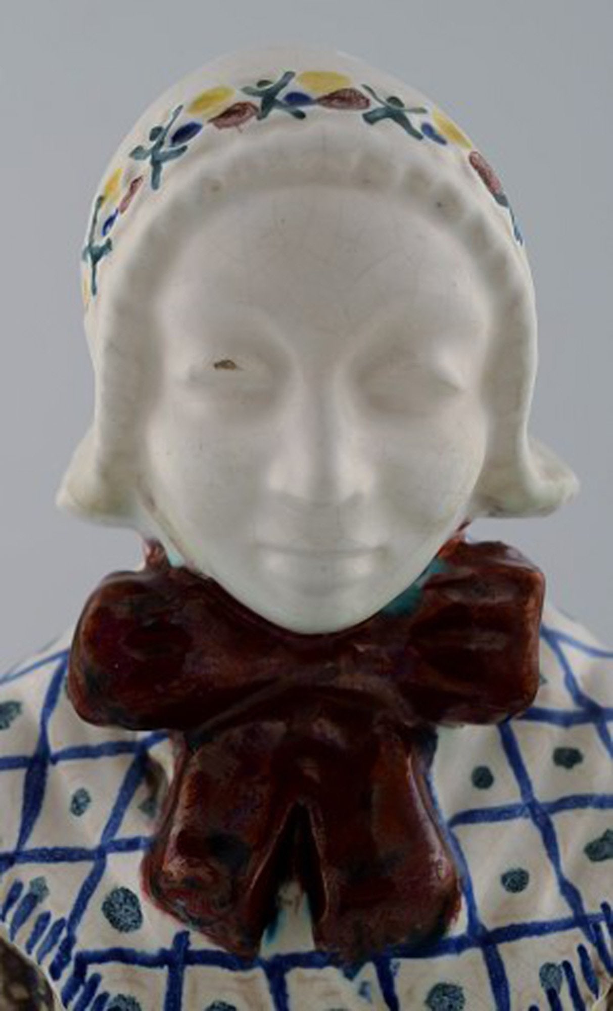 Michael Andersen Ceramics from Bornholm. Large figure of woman with Songbook in national dress. No. - 7