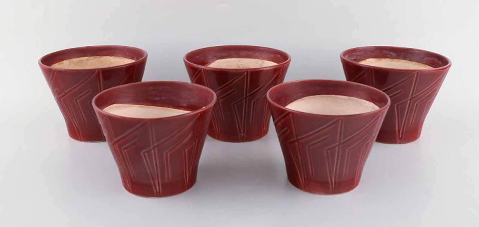 Five Bo Fajans Marianne flower pots in glazed ceramic. Beautiful red glaze and geometric pattern.: Title: Five Bo Fajans Marianne flower pots in glazed ceramic. Beautiful red glaze and geometric pattern. Swedish design, 1960s / 70's. Description: Five Bo Fajans Marianne flower pots in glazed cerami