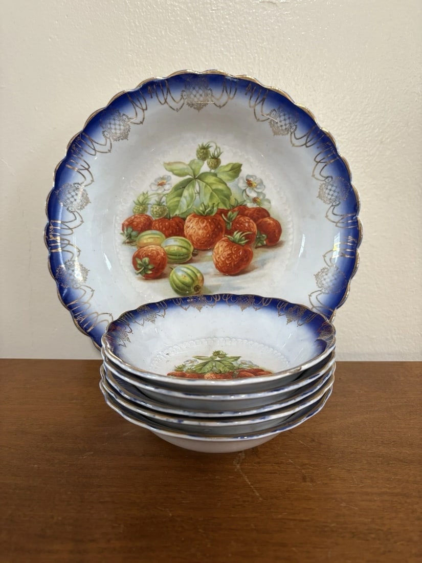 6 Pc Flow Blue Strawberry Set: For sale is a 6 pc flow blue strawberry set. The large bowl measures 9” x 2 1/8” high and is marked. The berry bowls measure 5 1/2” x 1 1/2” high. They set has no chips, cracks