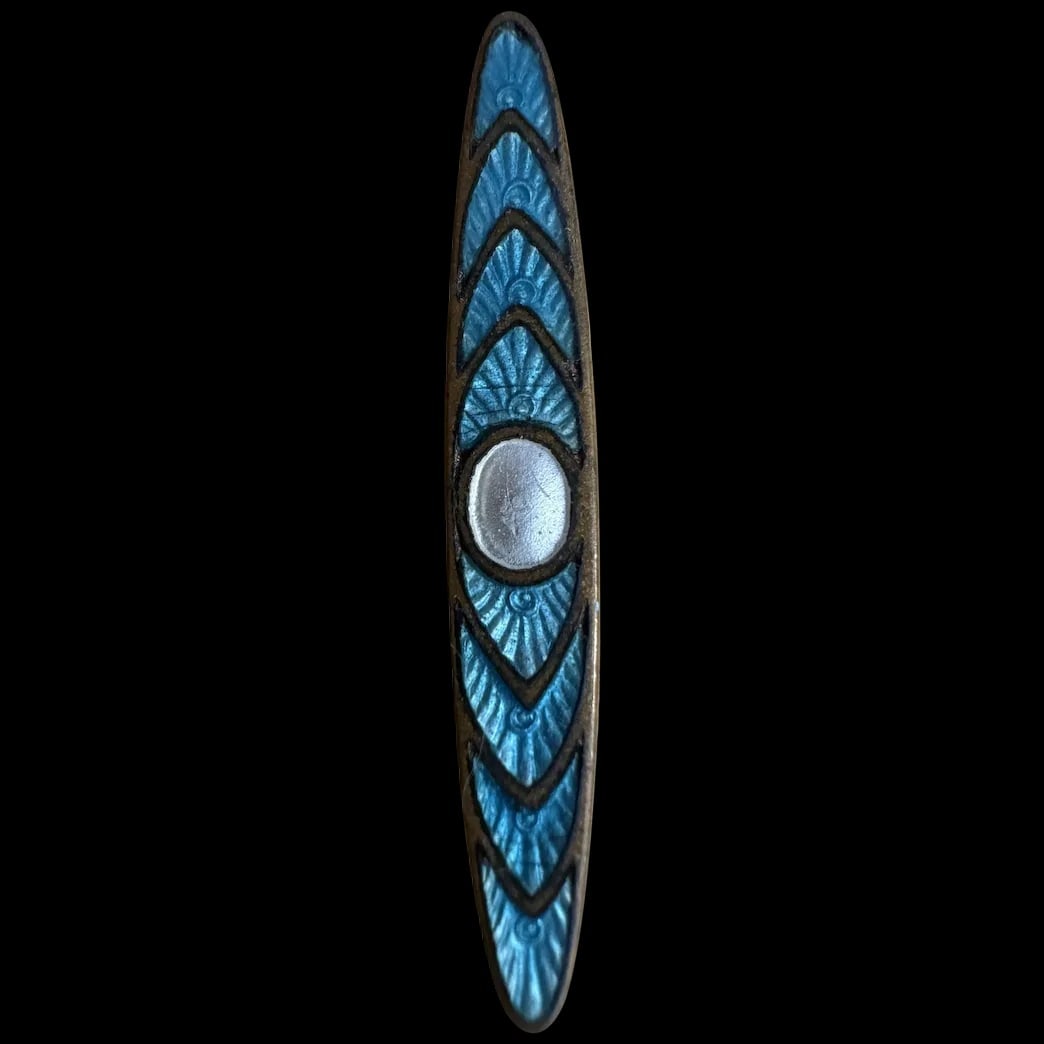 Antique turquoise Guilloche enamel brooch or pin Art Deco: Antique turquoise enamel brooch or pin, possibly in an Art Deco or Scandinavian modernist style. The design features a central silver-toned circle surrounded by stylized, symmetrical patterns in a vib