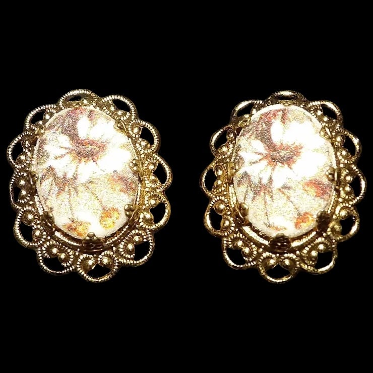 Vintage W. Germany Sugared Filigree Clip on Earrings: This pair of W. Germany Sugared Filigree Clip on Earrings is in excellent condition. Gold is bright- clips strong. They measure 1” x 7/8”- oval shape. Item id: ls009522 Type: Costume Color