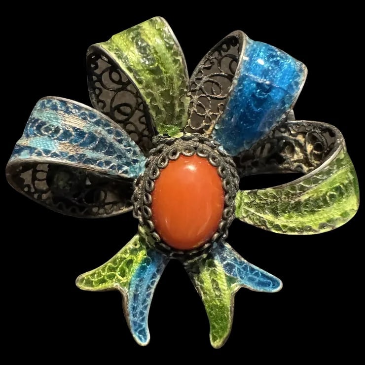 Vintage Filigree 800 Silver Red Coral Fine Mediterranean Chinese export enamel Bow Brooch: This is vintage sterling silver brooch featuring an exquisite natural coral cabochon. The body of the brooch is comprised of hand filigree ribbons in a bow shape. The center stone is a rich reddish-or