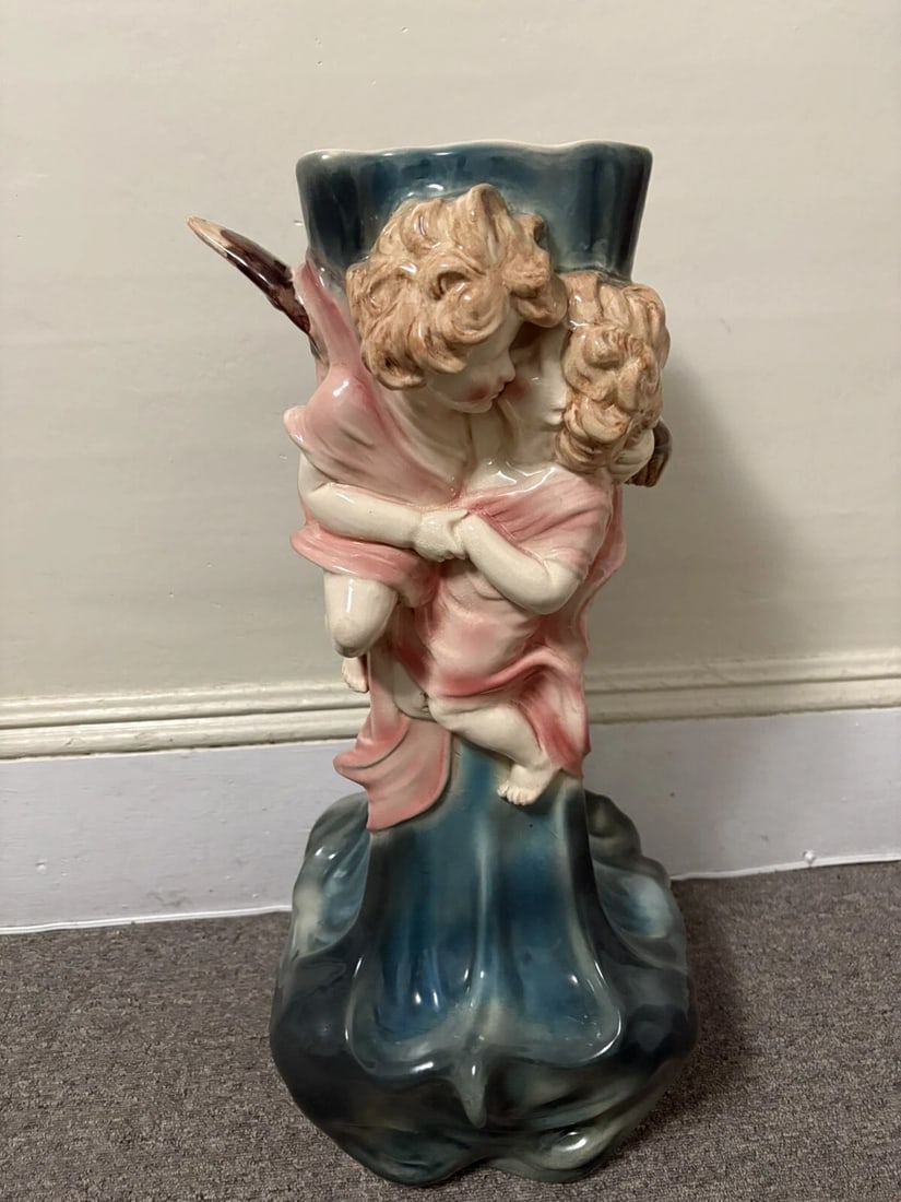 Terre D’Eclance Charenton Art Nouveau Pottery Cherub Majolica Unbrella Stand: It measures 28 1/4” x 12 1/4” at the base and is artist signed and marked. It was made in paris france around 1900. It had a professional hole drilled and later filled in the corner of the