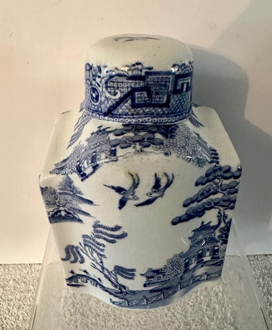 Staffordshire Blue Willow Tea Canister w/Lid: A Staffordshire Tea Canister, complete with lid, in the Standard Blue willow Pattern dating c. 1830. It is most. Unusual to find a 19th center tea canister complete with its original lid; nojt the cur
