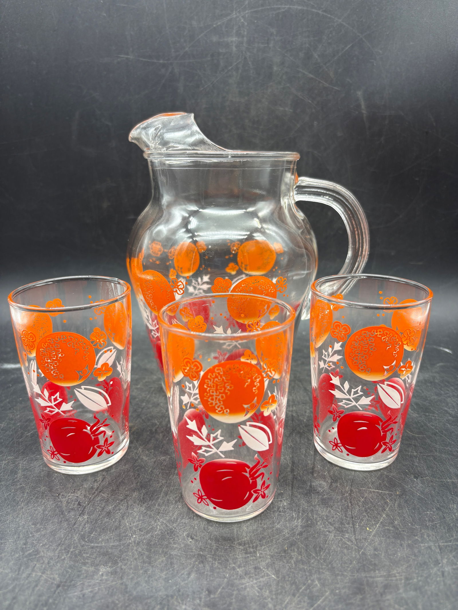 Vintage Anchor Hocking Pitcher & Juice Beverage Set Orange and Tomato: Date/Period: Approx. 1950's Dimension: glasses approx 4" x 2", pitcher approx 7" x 5" Material: glass Additional Information: Vintage Anchor Hocking Pitcher & Juice Beverage Set Orange and Tomato Ship