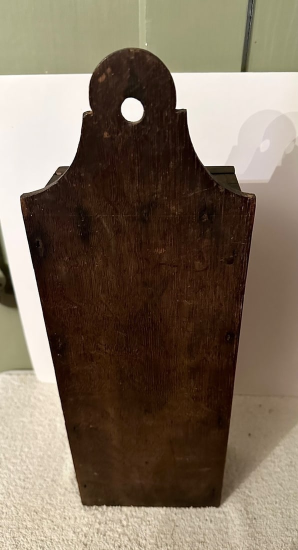 Mahogany Slide Lid Hanging Candle Box: This Mahogany hanging candle box that has a lid that slides up to get the candle. It is meant to hand near the fireplace or wood stove. It has an elegant crest at the top and rich, mahogany color.