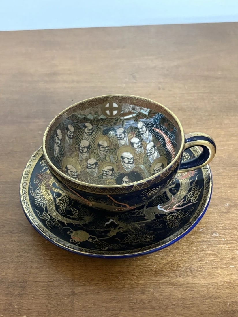 Cobalt Japanese Satsuma Cup & Saucer: The saucer measures 5 1/2” and is marked. The cup measures 4 5/8” x 1 7/8” and is marked. The set has no chips, cracks or repairs Shipping: Domestic: Flat-rate of $15.00 to anywhere