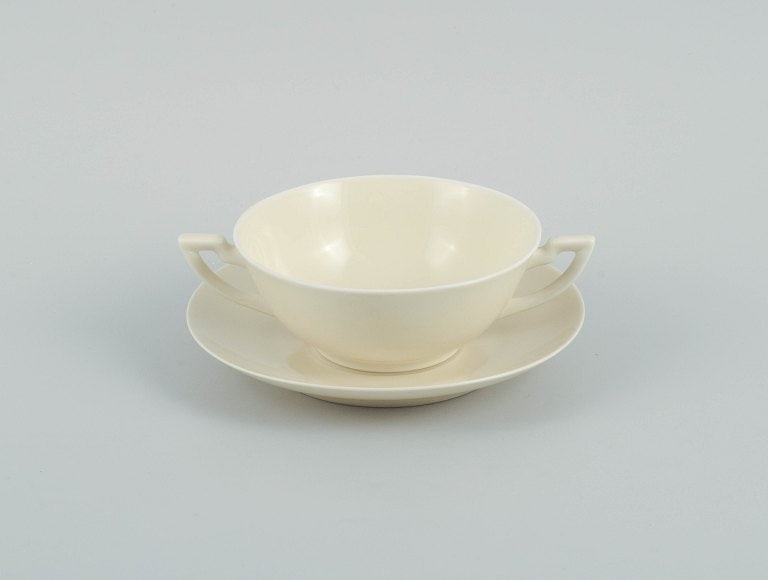 Nine pairs of Royal Copenhagen cream-coloured bouillon cups with matching saucers. - 3