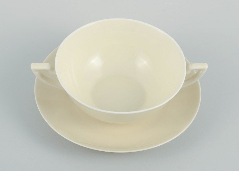 Nine pairs of Royal Copenhagen cream-coloured bouillon cups with matching saucers. - 4