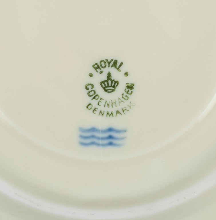 Nine pairs of Royal Copenhagen cream-coloured bouillon cups with matching saucers. - 5