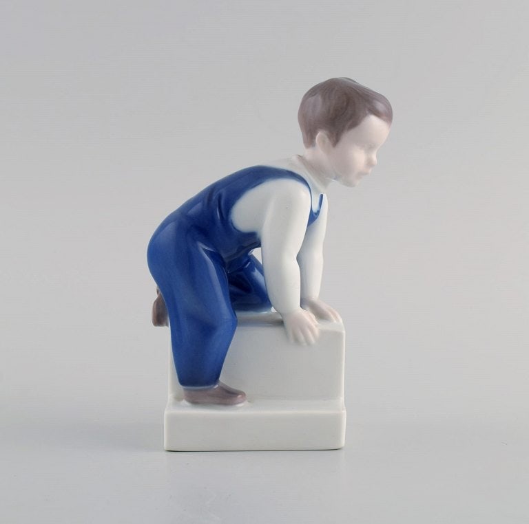Claire Weiss for Bing & Grøndahl. Porcelain figure. Boy. 1970s. Model number 2399. (1 of 6)