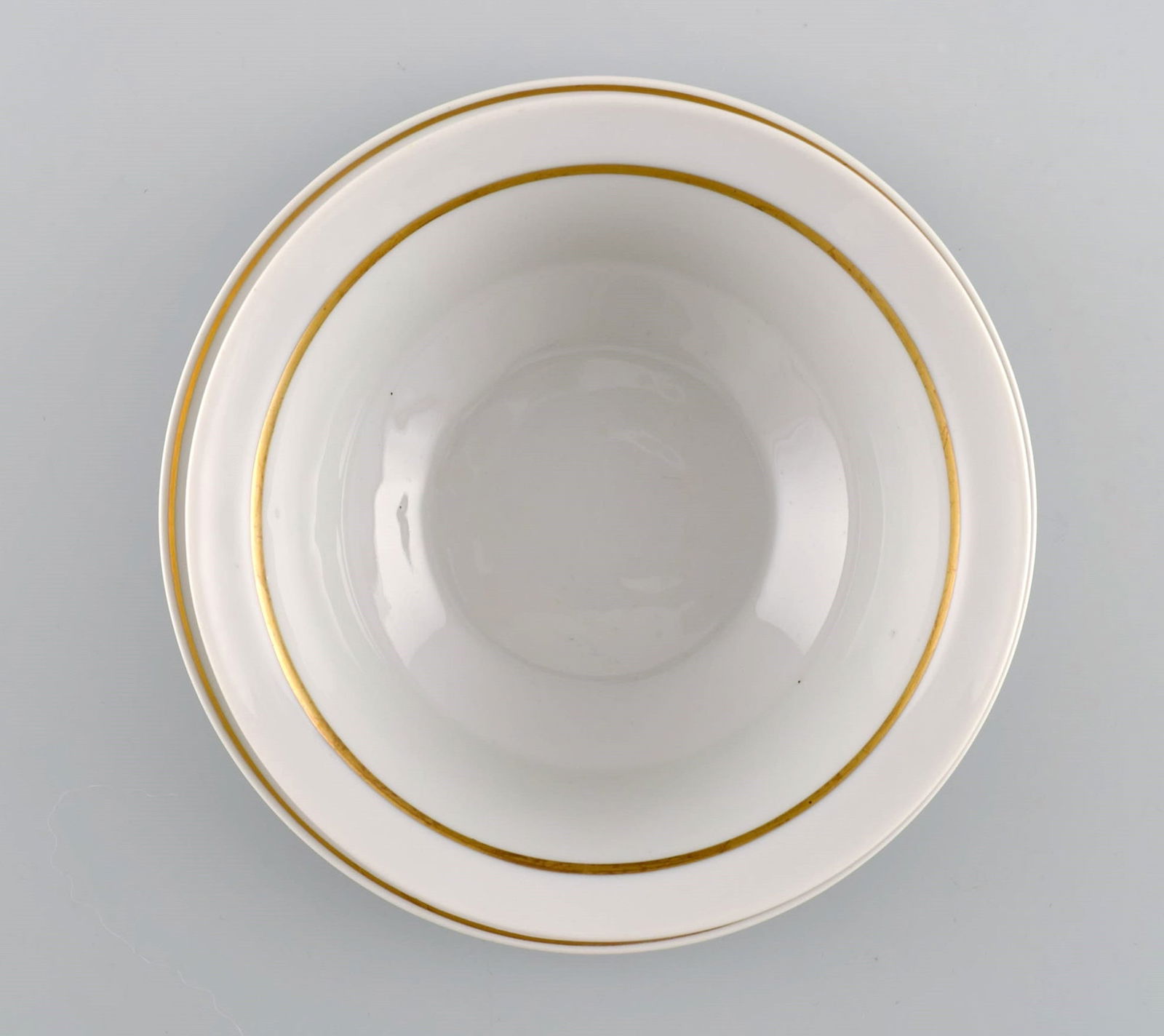 Royal Copenhagen service no. 607. Porcelain sauce bowl. Gold border with foliage. Model number - 4