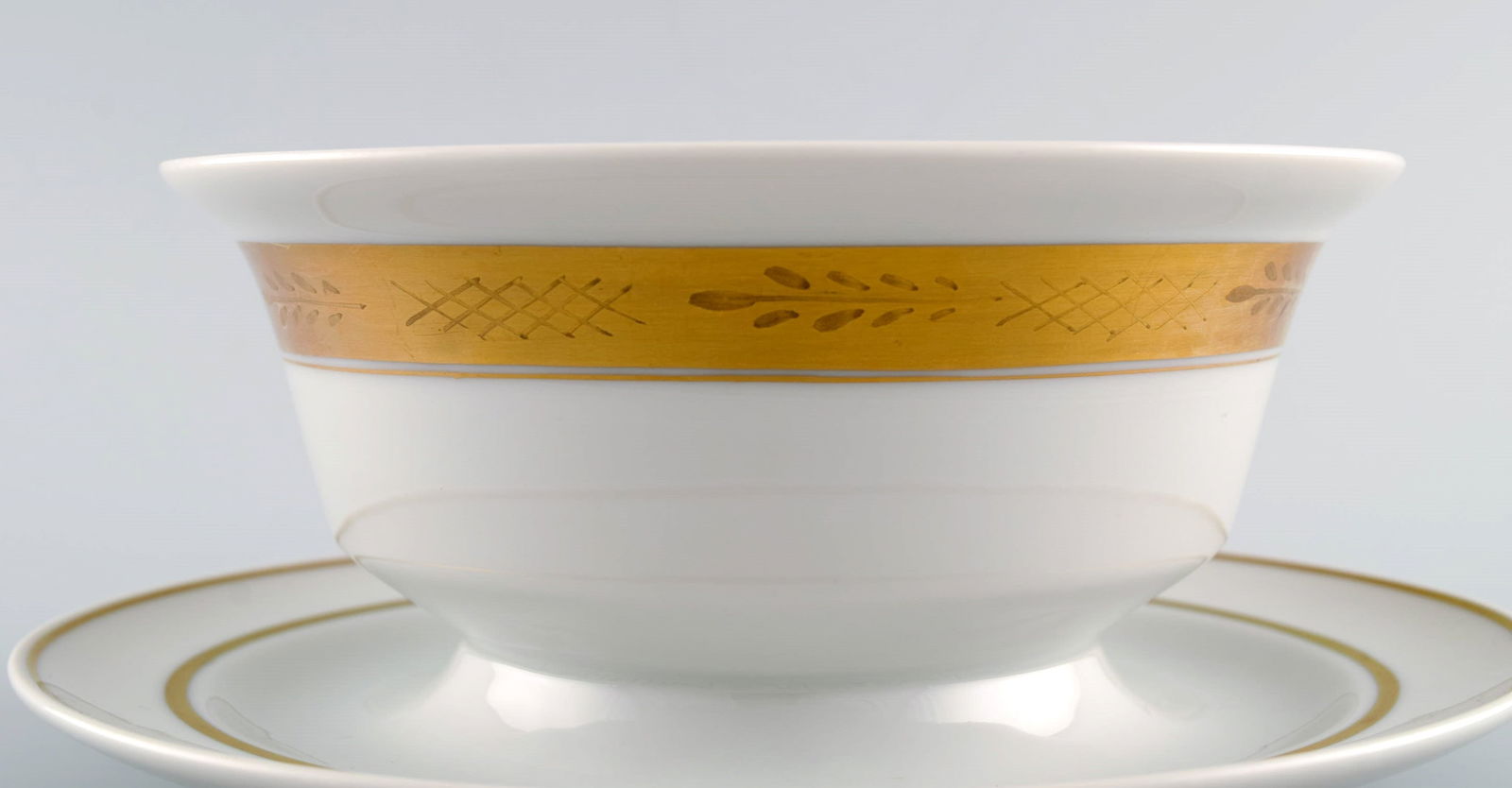 Royal Copenhagen service no. 607. Porcelain sauce bowl. Gold border with foliage. Model number - 5