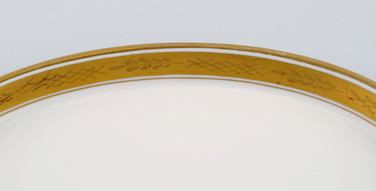 Royal Copenhagen service no. 607. Two oval porcelain dishes. Gold border with foliage. Model number - 4