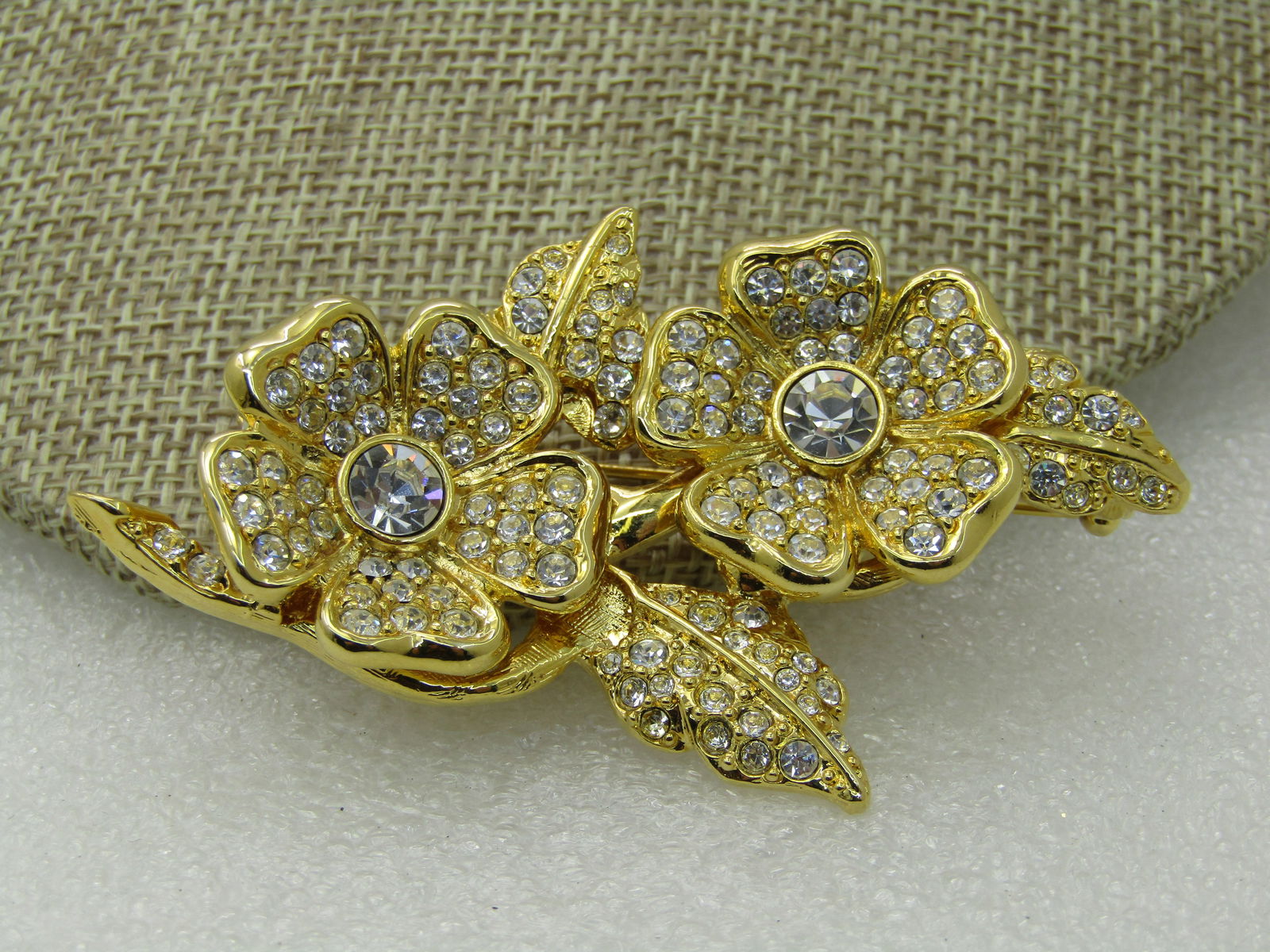 Vintage Joan Rivers Floral Duo Earrings Brooch Convertible, Clear Stones 3": Vintage Joan Rivers Floral Duo Earrings Brooch Convertible, Clear Stones 3" wide and 1.75" tall, the two blossoms in the brooch can click out and be worn as clip earrings - convertible set, gold tone