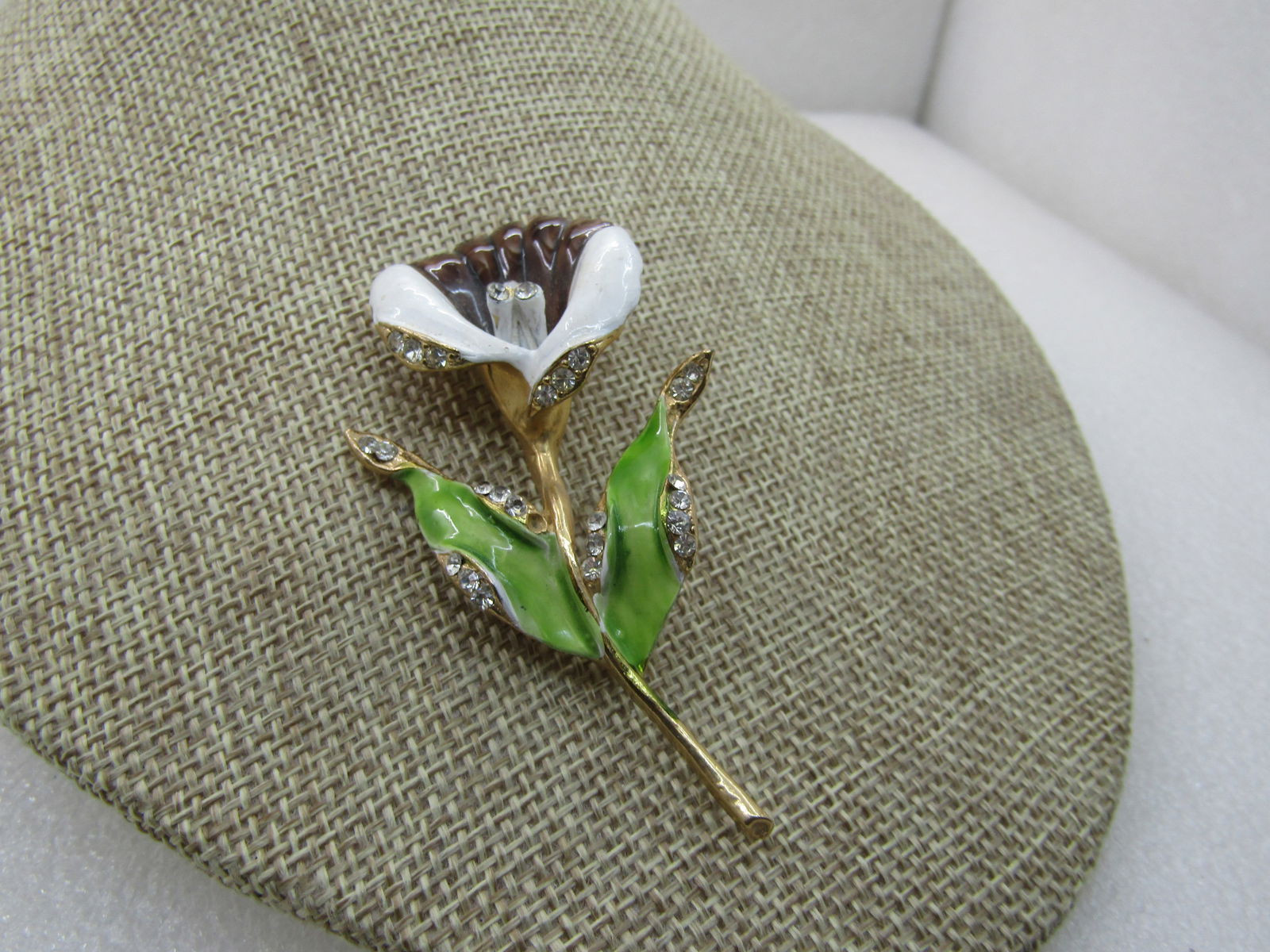 Vintage Enameled Lily with Rhinestone Brooch, 1960's, Statement Brooch, 3": Vintage Enameled Lily with Rhinestone Brooch, 1960's, Statement Brooch, 3" tall and 1,.5" wide. White and Brown enameled blossom with pave set rhinestone front edge and three stamen with rhinetones. T