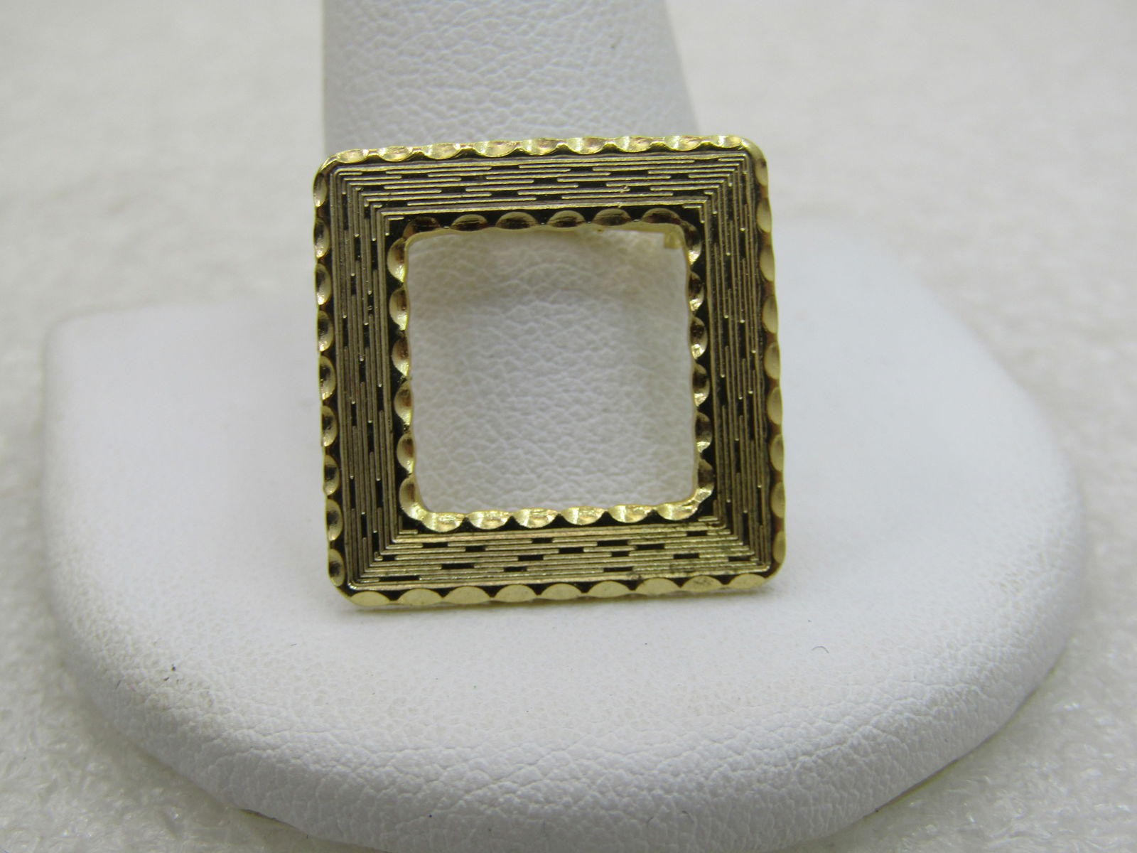 Vintage Square Brooch, Open Center, 3/4" Gold Tone, 1960's NL: Vintage Square Brooch, Open Center, 3/4" Gold Tone, 1960's with a textured and shiny finish. Not signed by the maker. Very good condition. (INV. W. 8.1118.2 LD 2/5/20 WB432 NL). Reserve: $25.00 