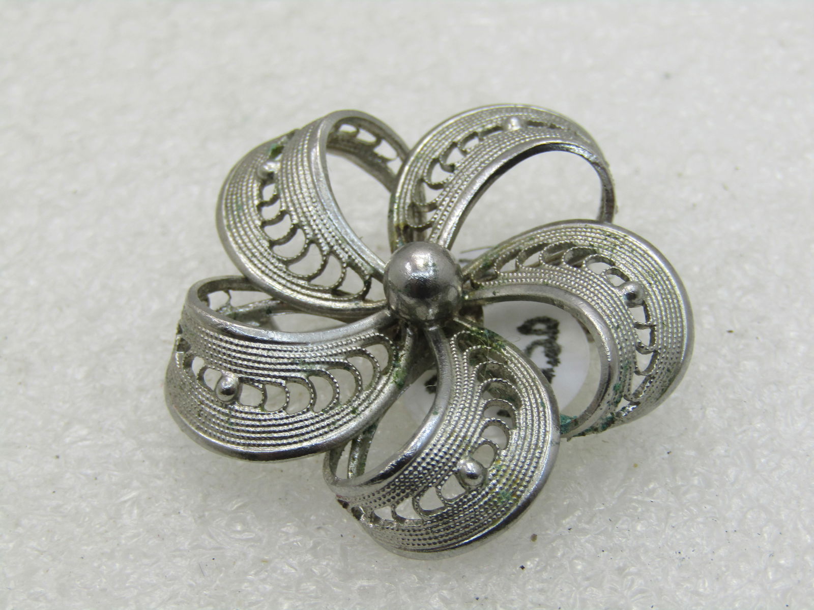 Vintage Western Germany Filigree Blossom Brooch, Mid-Century: Vintage Western Germany Filigree Blossom Brooch, Mid-Century, 1-3/8" across with five curved and bent filigree petals and a center bead. Signed Western Germany on the back. 1950's-1960's. Silver