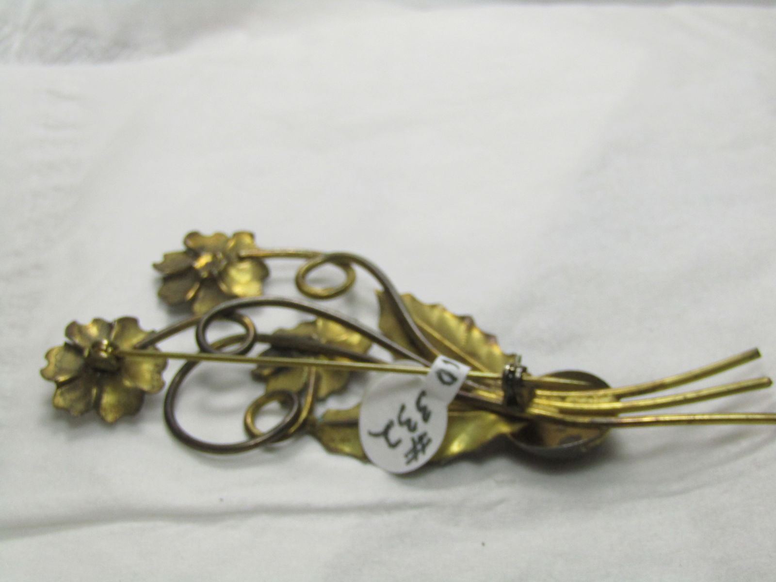 Vintage Gold over Sterling Floral Brooch, 1940's, Art Deco, 3.5": Vintage Gold over Sterling Floral Brooch, 1940's, Art Deco, 3.5" - signed Sterling and tested. The gold plating over is worn in some areas. It has red stones in the center of the blossoms. Three total