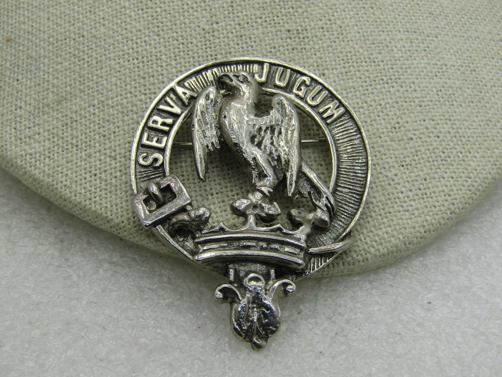 Vintage Scottish Serva Jugum Clan Brooch, Kilt Pin, "My Word": Vintage Scottish Serva Jugum Clan Brooch, Kilt Pin, "My Word" Hay Clan, 2" by 1-5/8", features a belt, crown in an open center pin, heavy silver tone metal. 1960's-1980's. Signed but cannot make out.