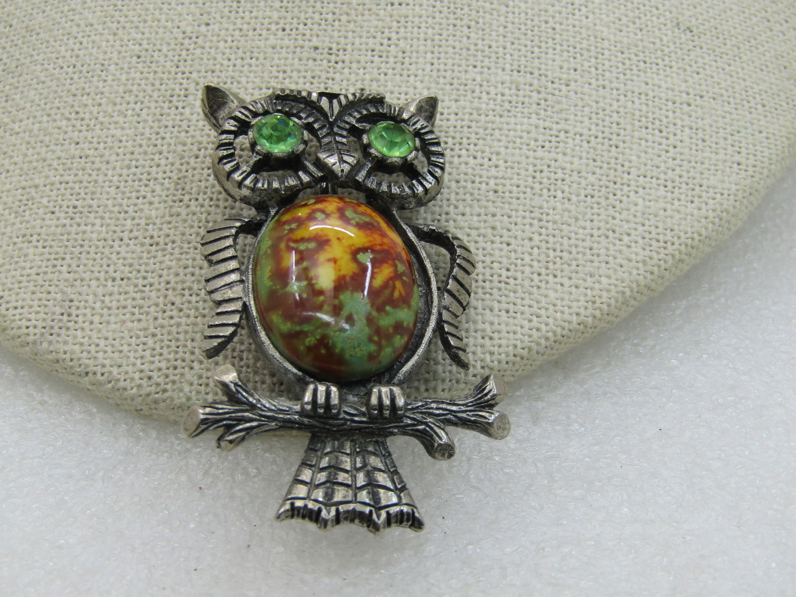 Vintage Rhinestone & Faux Agate Owl Brooch, Pewter Tone, 1960's-1970's: Vintage Rhinestone & Faux Agate Owl Brooch, Pewter Tone, 1960's-1970's 2.25" tall and 1-3/8" wide. Not signed by the maker. 6.5mm green rhinestone eyes with an agate-like oval cabochon as the torso. T