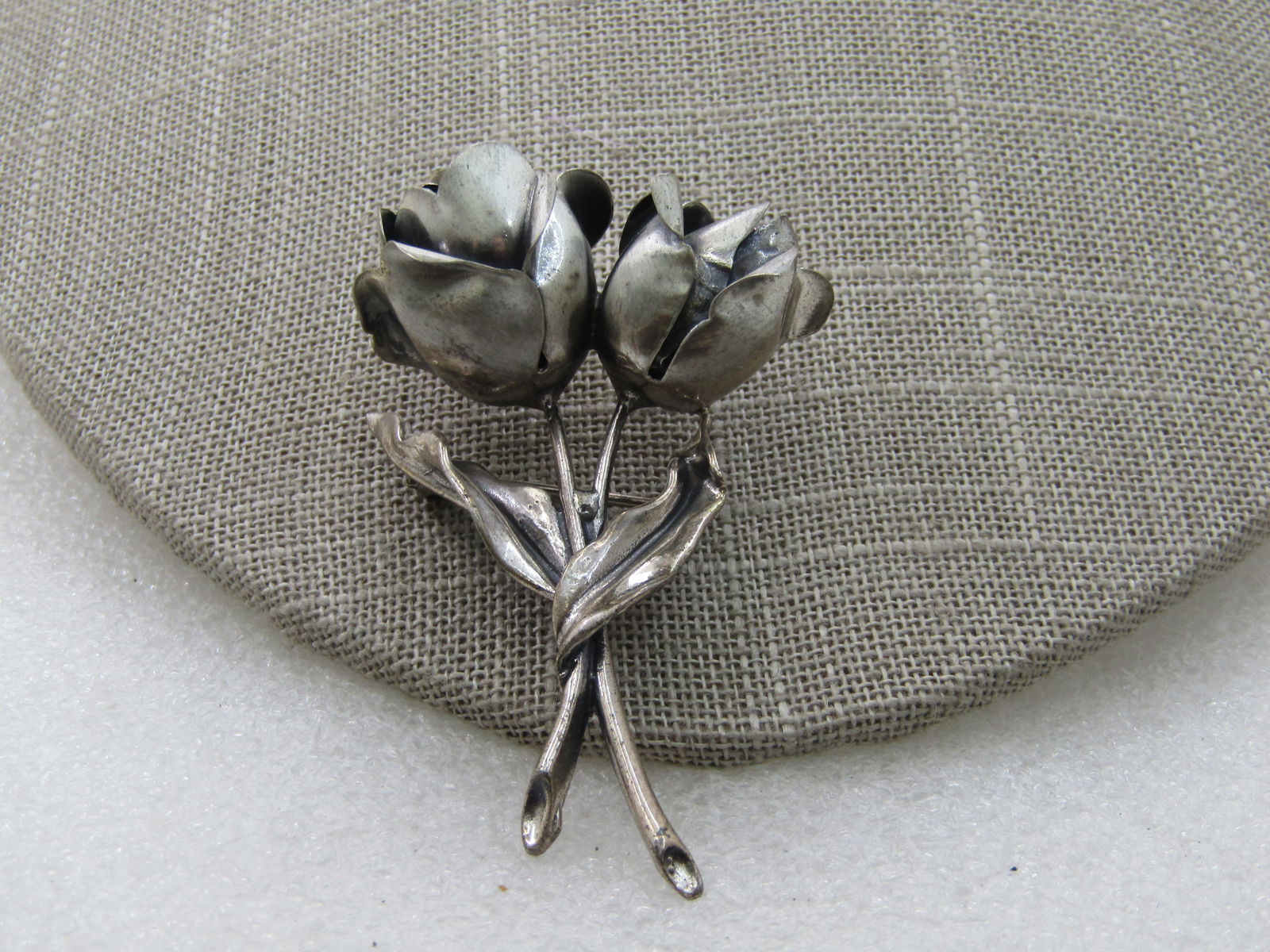 Vintage Sterling Jewel Art Brooch, Double Rose Brooch, 1960's,: Vintage Sterling Jewel Art Brooch, Double Rose Brooch, 1960's, 2.25" tall and 1.5" wide. Signed Jewel Art Sterling. 1960's. Weight is appx. 13.95 gr. 3-D blossoms with stems and leaves. (INV. W.112120