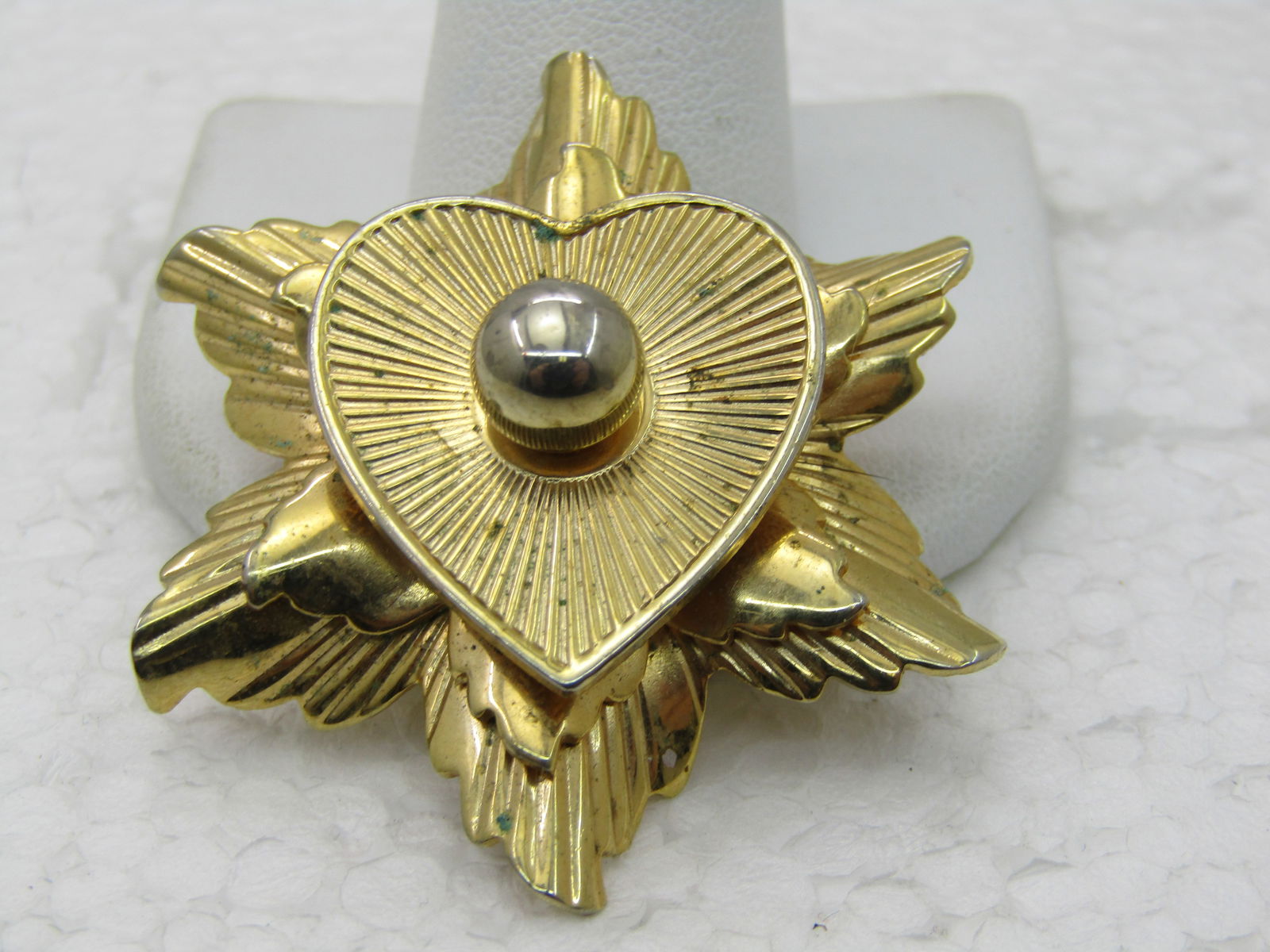 Vintage Heart & Rays Tiered Brooch, Gold Tone, 1-7/8", 1960's.: Vintage Heart & Rays Tiered Brooch, Gold Tone, 1-7/8", 1960's. This has a 7.5mm ball type bead on top. Ridged design with smooth and shiny surfaces too. Good condition, light wear. Not signed by the m