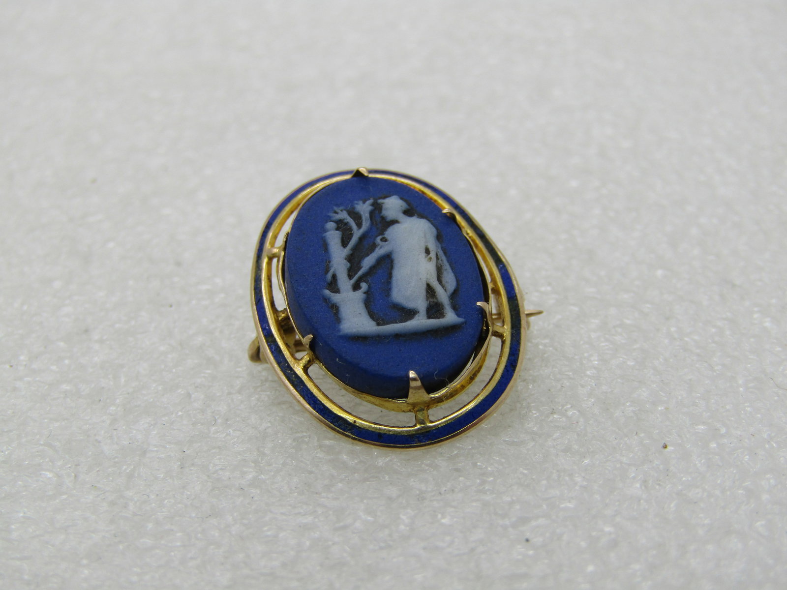 Vintage 10kt Wedgwood Cameo Enameled Brooch Pendant: Vintage 10kt Wedgwood Cameo Brooch Pendant, 1" by 3/4" - when the pendant loop is extended it is appx. 1.25" tall. Age is appx. mid-century. The cameo is what looks like a mail near a plant. There are