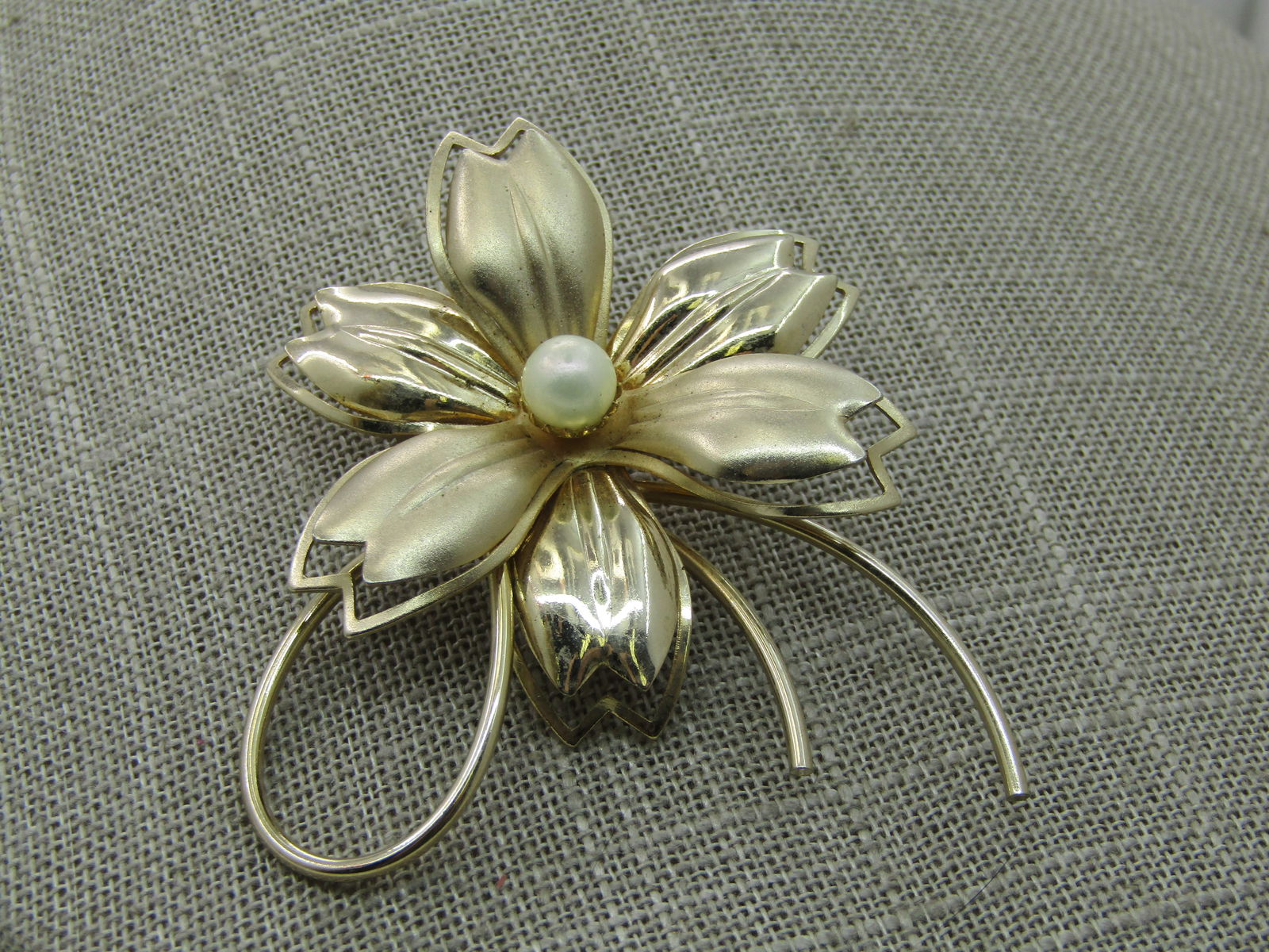 Vintage Modern Blossom Brooch, Faux Pearl, 2.5", 1960's: Vintage Modern Blossom Brooch, Faux Pearl, 2.5", 1960's. 2.5" with looped and swirled stem and shiny and satiny tiered leaves with cutout outlines. Not signed by the maker. Very good condition. (INV.