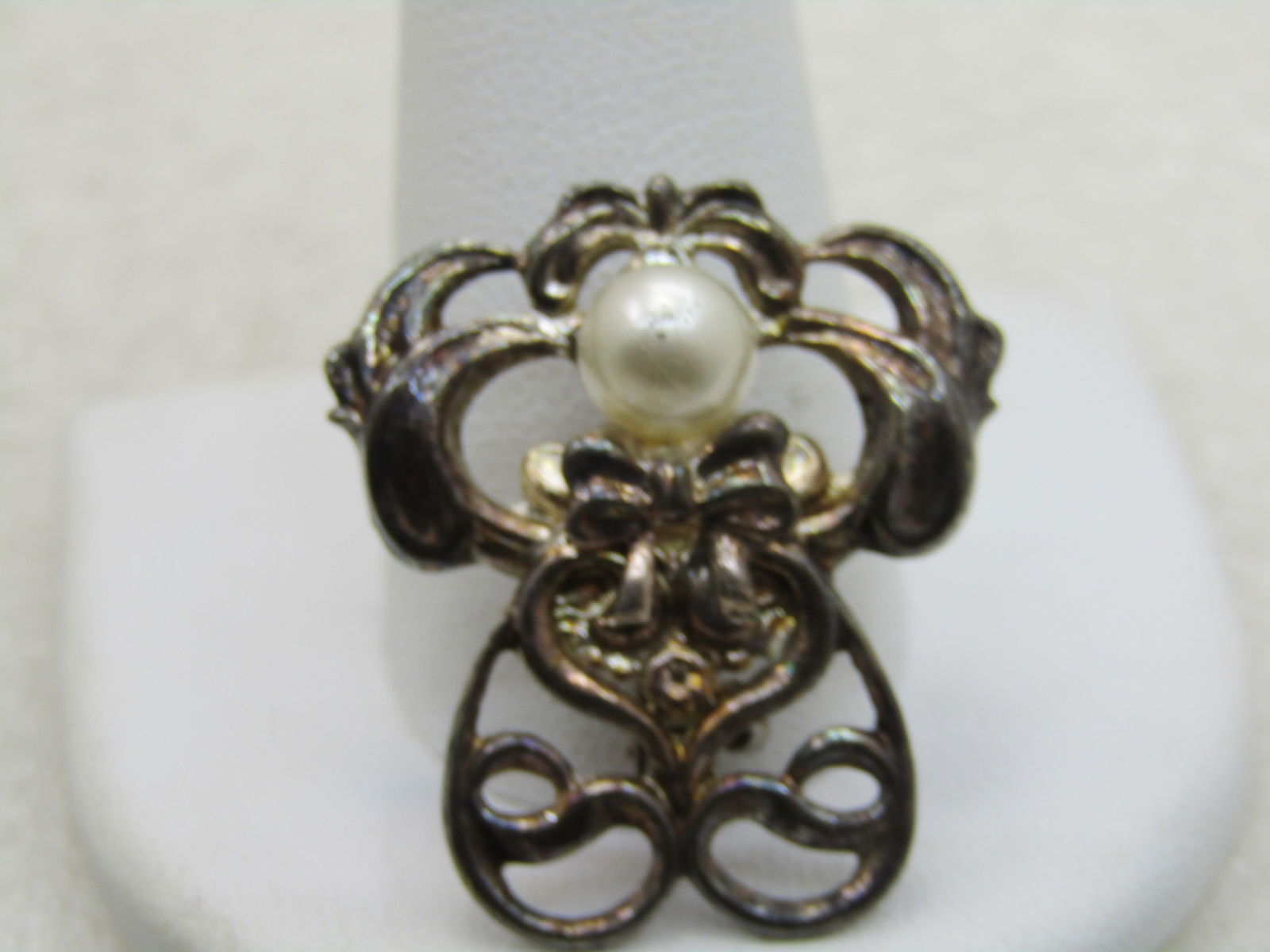 Vintage Angel Brooch Signed Jane with Faux Pearl Red Heart: Vintage Angel Brooch, Faux Pearl, Signed Jane, 1.25" tall and slightly over 1" wide. Silver Tone, filigree scrolled design. 1990's. Good condition, some light oxidation which will polish away. (INV. W