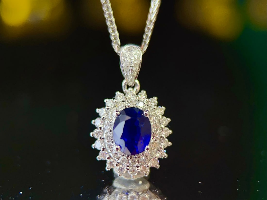 Ceylon Royal Blue Sapphire Pendant with Diamonds, 1.12ct: Title: Ceylon Royal Blue Sapphire Pendant with Diamonds, 1.12ct Description: Elegant pendant featuring a natural Ceylon royal blue sapphire (1.12 carats) set in 18K gold, accented with 51