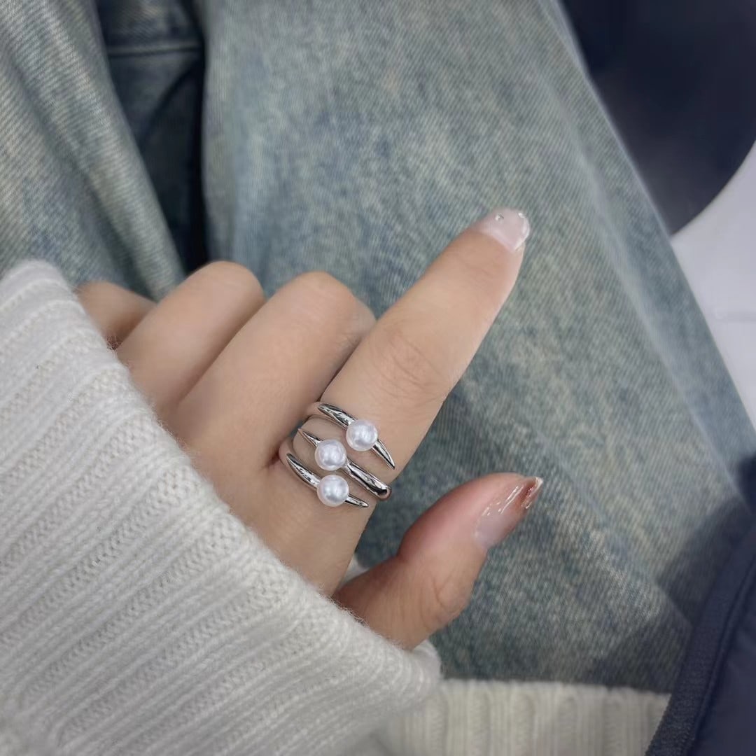 Sterling Silver Adjustable Ring with 4-5mm Freshwater Akoya Pearl: Title: Sterling Silver Adjustable Ring with 4-5mm Freshwater Akoya Pearl Description: Elegant sterling silver ring featuring a 4-5mm freshwater Akoya pearl with iridescent mirror-like luster. The ring