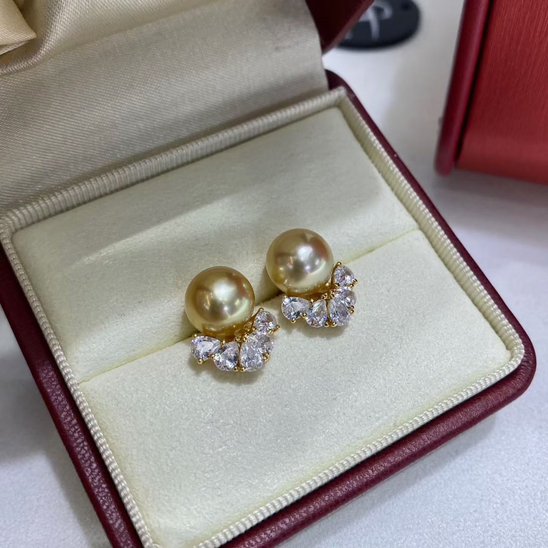 9-10mm Natural South Sea Golden Pearl Stud Earrings: Title: 9-10mm Natural South Sea Golden Pearl Stud Earrings Description: air of stud earrings featuring 9-10mm high-domed, near-round natural South Sea golden pearls. Pearls are nearly flawless with st