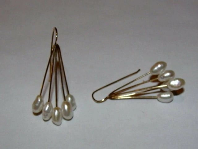14 kt Gold Freshwater Pearl Drop Earrings: Title:14 kt Gold Freshwater Pearl Drop EarringsDescription:Simple, classic, and elegant. 14 kt gold handmade earrings with freshwater pearls. Circa 1960's. Earrings are 1 1/2" long and 3/4"