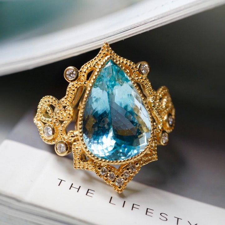 14K GOLD 5.11 CT NATURAL AQUAMARINE & DIAMOND RING: Title:14K GOLD 5.11 CT NATURAL AQUAMARINE & DIAMOND RINGDescription:Ref:230528320Gold Content:14K GoldRing Size:7.25USMain Gemstone:AquamarineNumber of stones:1Shape:PearCarat Weight:5.11ct