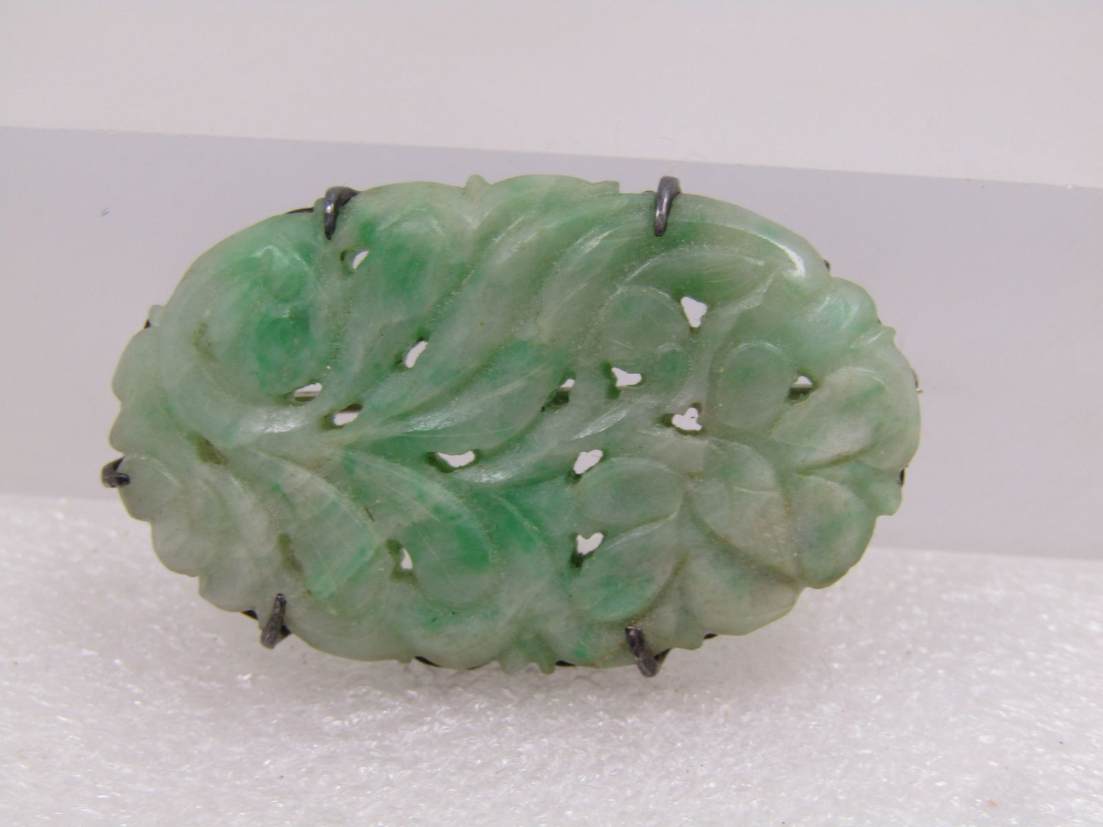 Antique Sterling Carved Jade Floral Brooch, 1920's: Title:Antique Sterling Carved Jade Floral Brooch, 1920's Description:Antique Sterling Carved Jade Floral Brooch, 1920's. This is an oval that is appx. 1-5/8" by 7/8" wide with five prong, locking clas