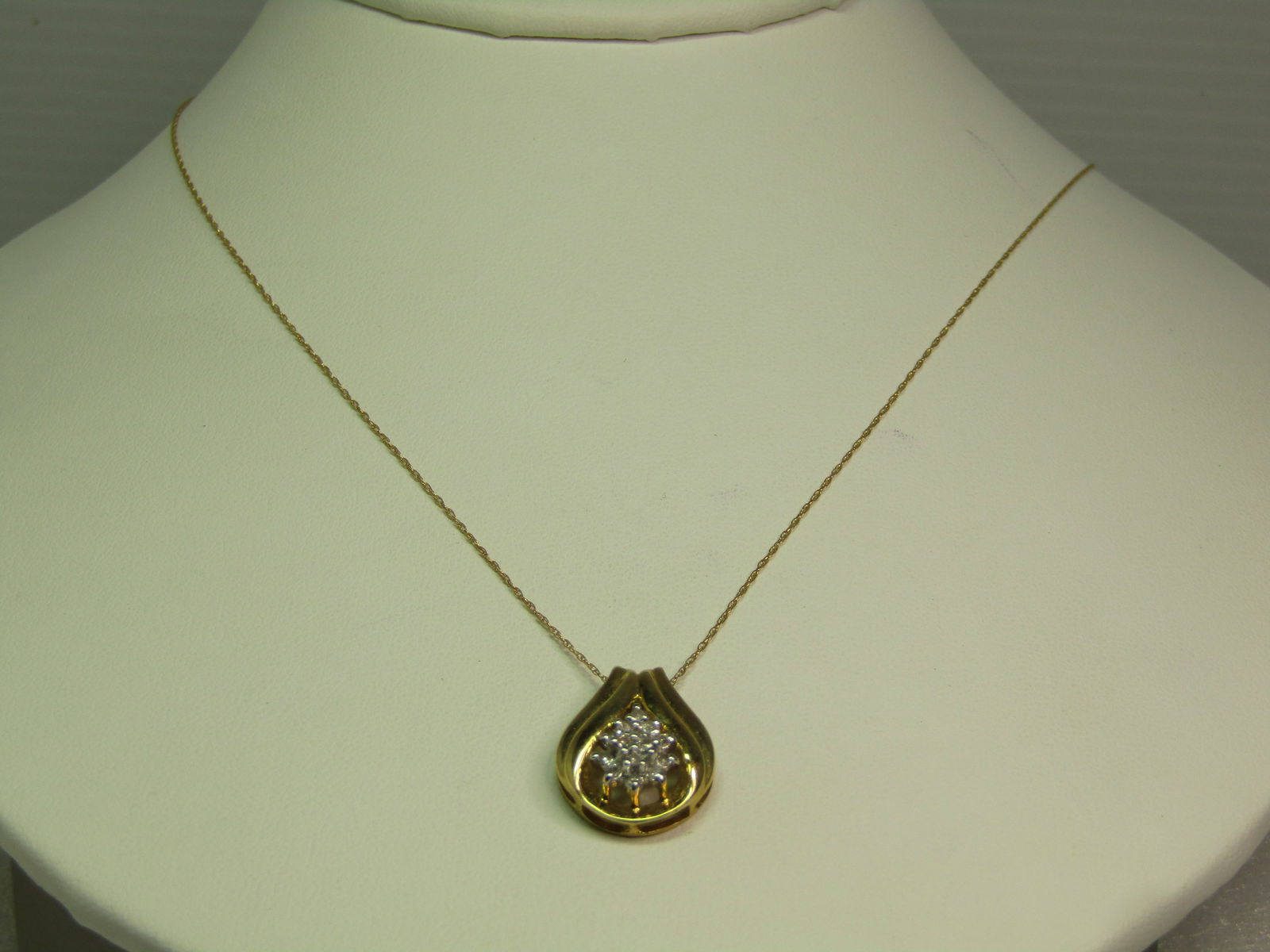 Vintage 10kt Diamond Necklace, 19", 1970's-1980's: Title:Vintage 10kt Diamond Necklace, 19", 1970's-1980's Description:Vintage 10kt Diamond Necklace, 19", 1970's-1980's. the pendant is appx. 3/4" by 1/2" yellow gold wrapped two tiered design with a ce