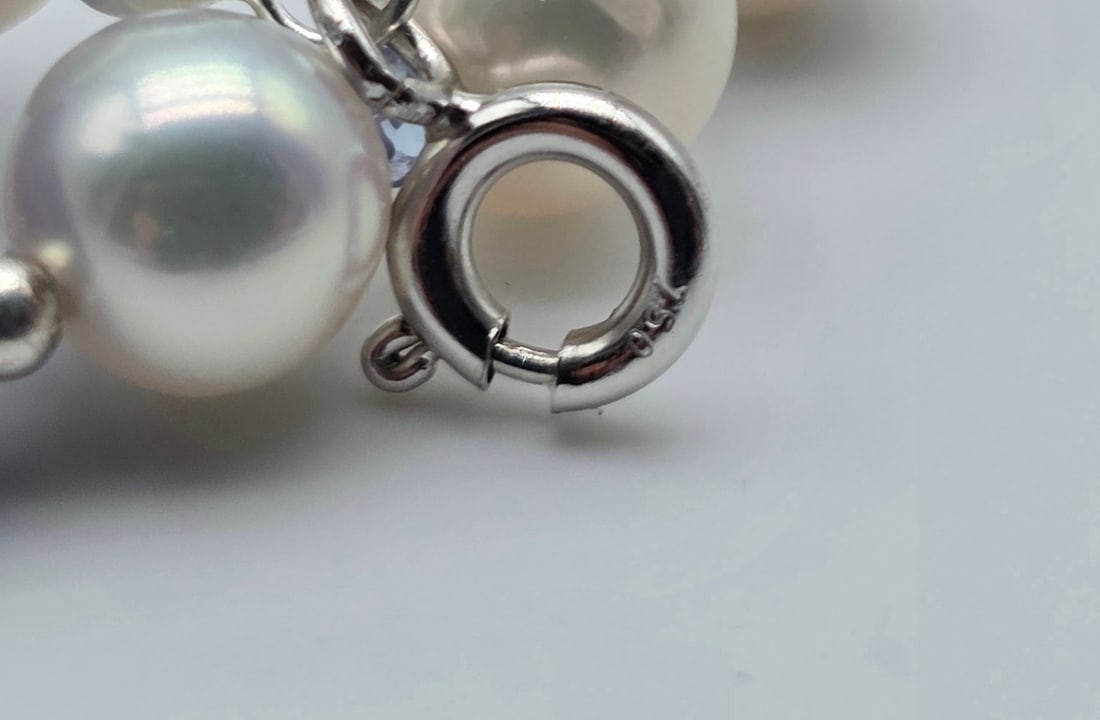 Akoya pearl necklace with a central tanzanite, gold spheres, tanzanite rondelles between each pearl, - 5