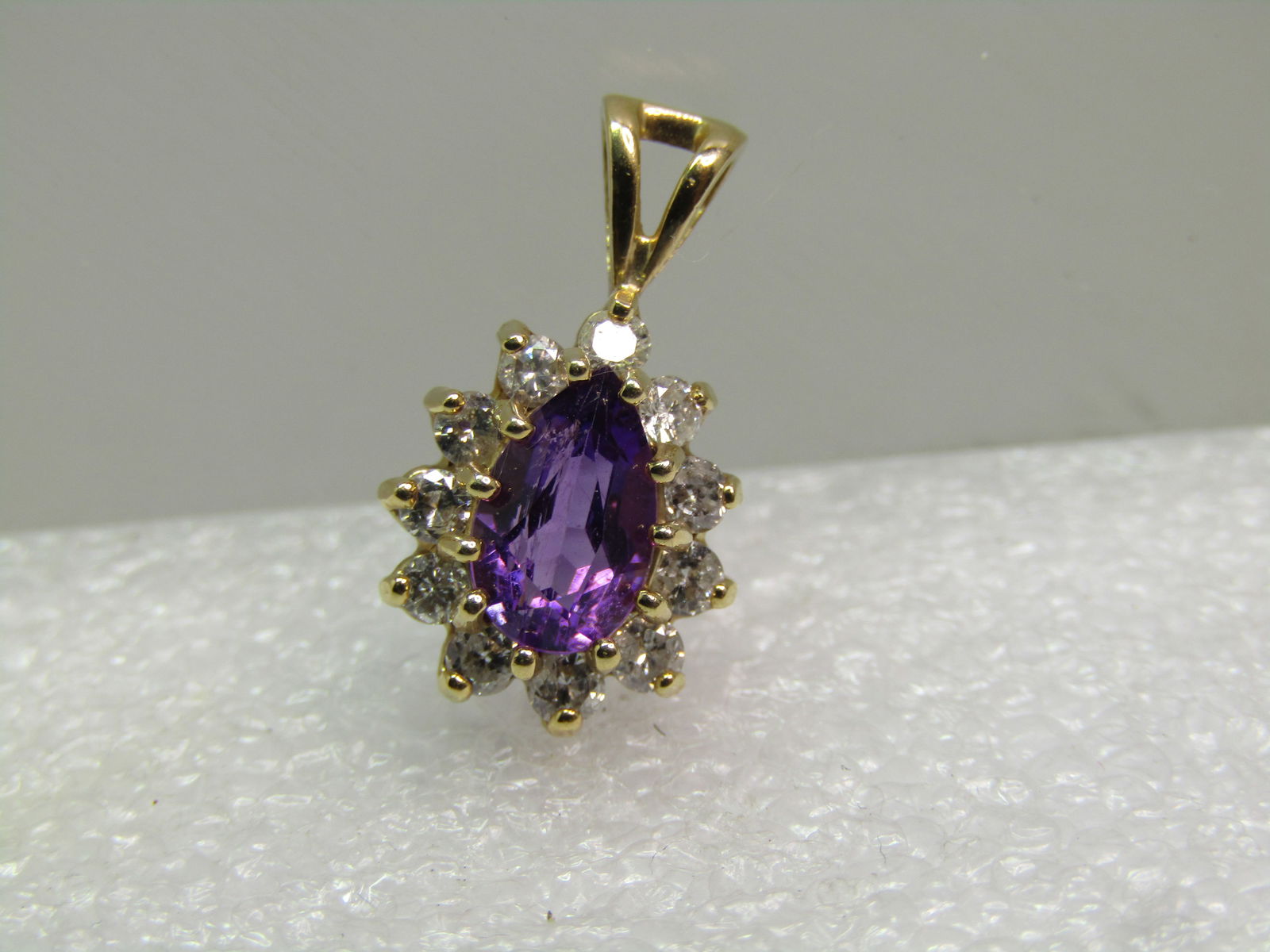 Vintage 14kt Amethyst & Diamond Pendant, Appx. 161 Grams, 1970's-1980's: Title:Vintage 14kt Amethyst & Diamond Pendant, Appx. 161 Grams, 1970's-1980's Description:Vintage 14kt Amethyst & Diamond Pendant, Appx. 1.61 Grams, 1970's-1980's. This has a pear-shaped amethyst that