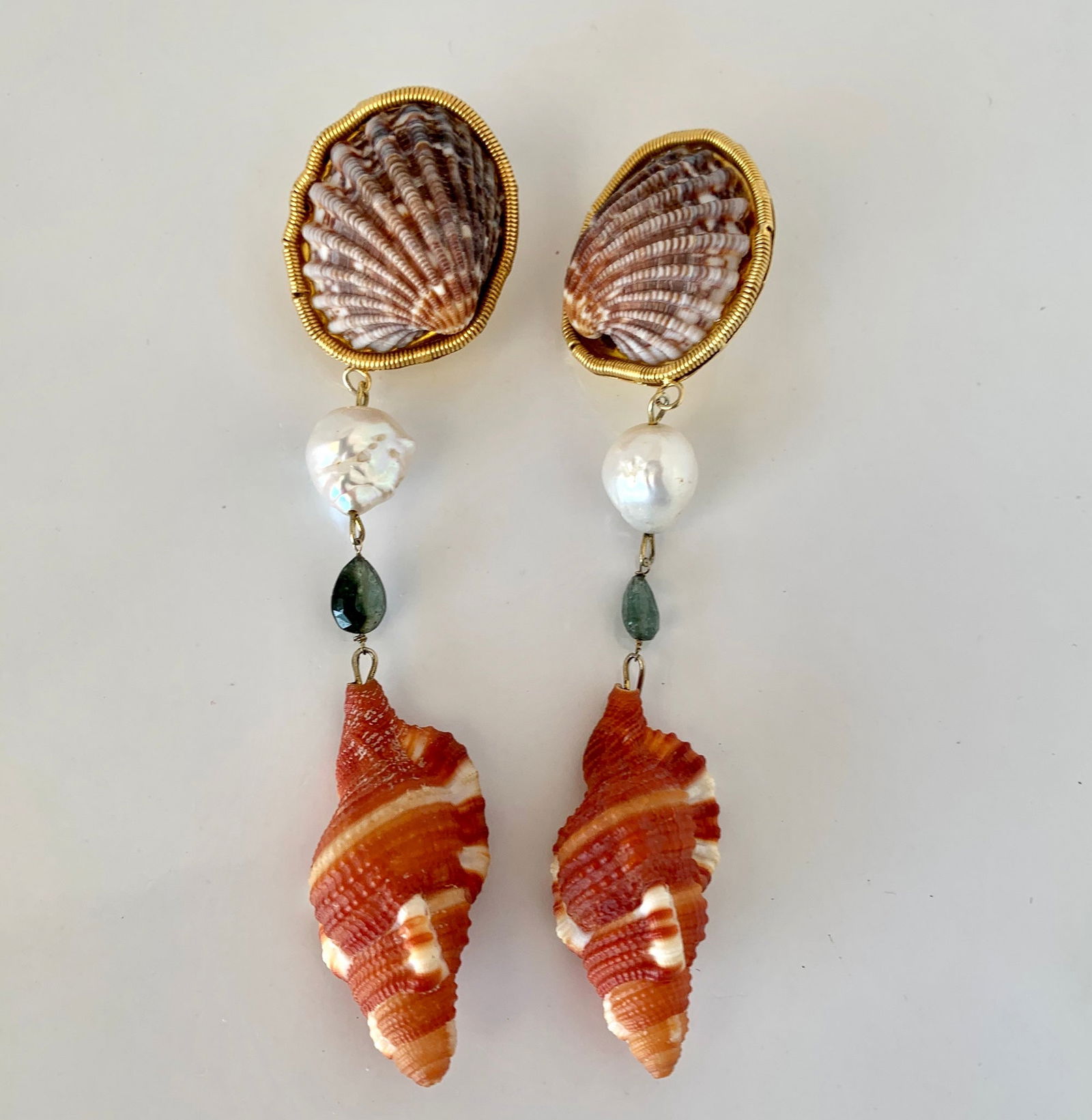 Cockle, Tourmaline, Pearl Vermeil Earrings: Title:Cockle, Tourmaline, Pearl Vermeil EarringsDescription:Light, long and comfortable, these Cockle Shell earrings are set in Vermeil with Omega pierced clips. Drops of Baroque Pearls and green