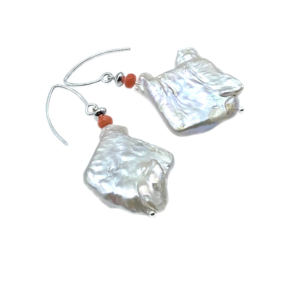 Keshi Freshwater Pearl Earrings: This single strand necklace was created with nine pieces of large (32- -34mm) Keshi freshwater pearls. 4mm faceted corals as spacers and a hammered sterling box clasp. Please see suggested matching