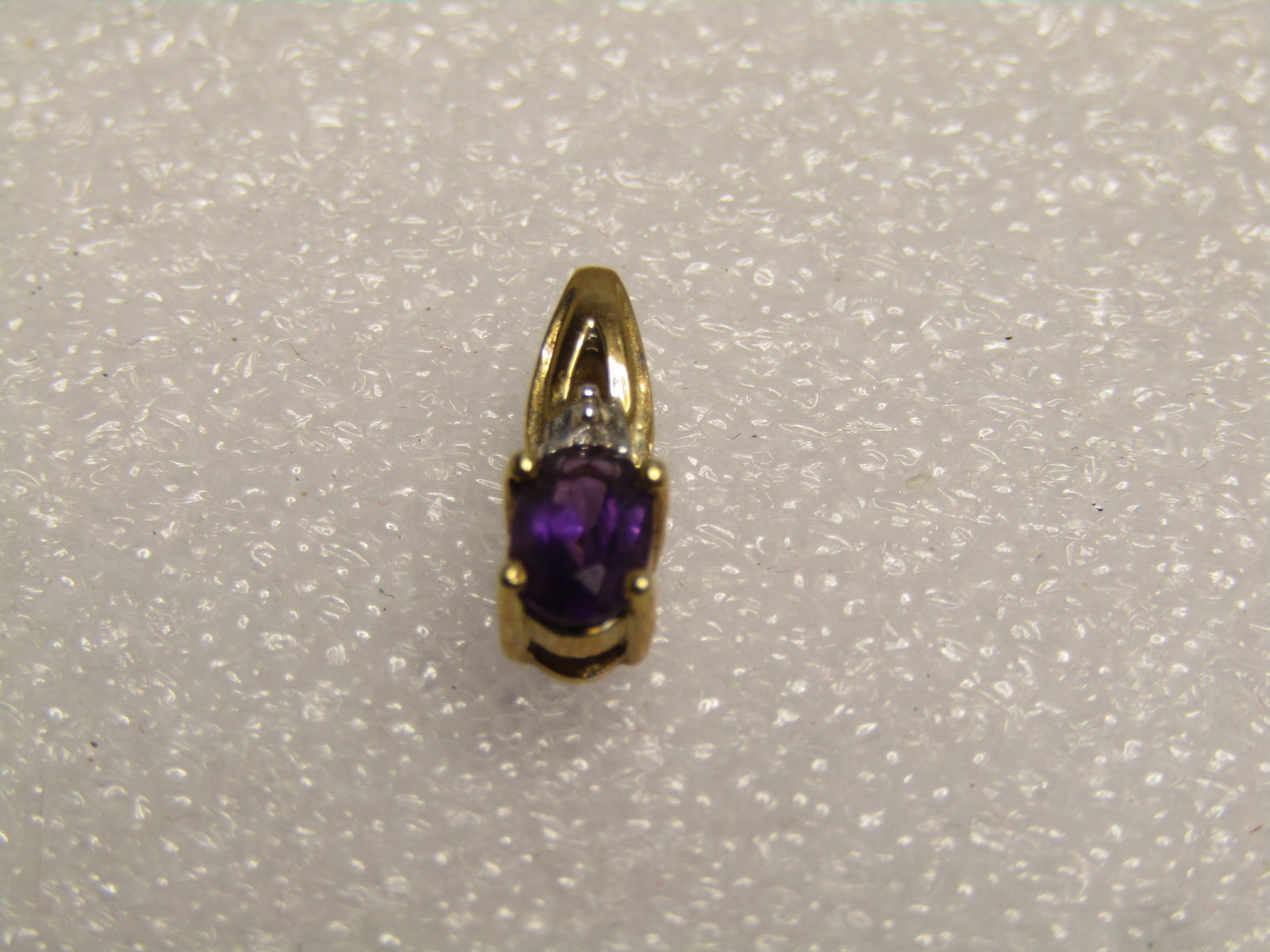 Vintage 10kt Amethyst Diamond Pendant, 1970's-1980's , Signed: Title:Vintage 10kt Amethyst Diamond Pendant, 1970's-1980's , SignedDescription:Vintage 10kt Amethyst Diamond Pendant, 1970's-1980's , Signedwith a C and diamond outline. The amethyst is an oval cut,