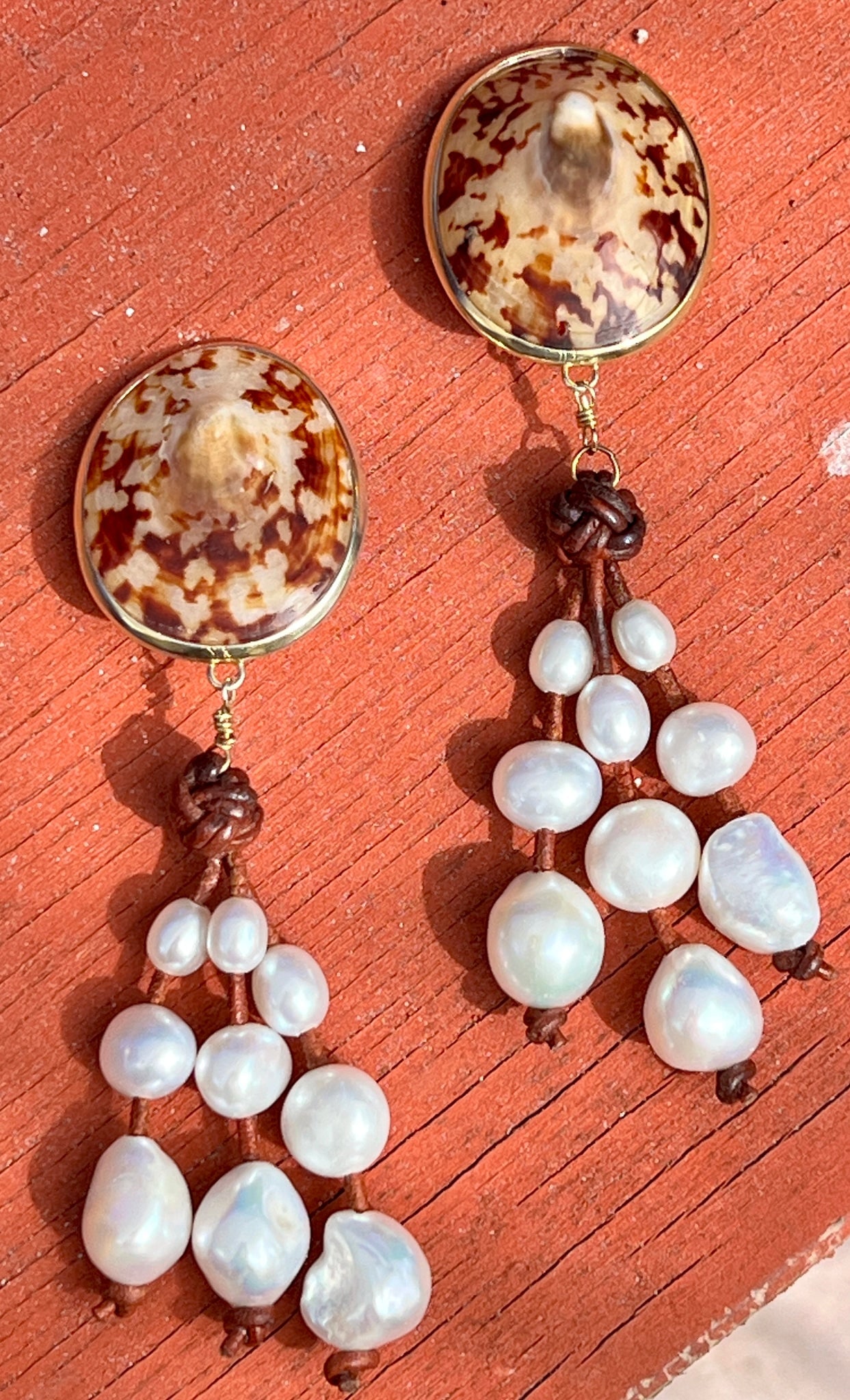 Tortoise Limpet and Pearl Vermeil Earrings: Title:Tortoise Limpet and Pearl Vermeil Earrings Description:Fun and dangly, these Limpet and Baroque Pearl earrings will effortlessly go from jeans to evening dress. Drop 3.5” from clip. Vermei
