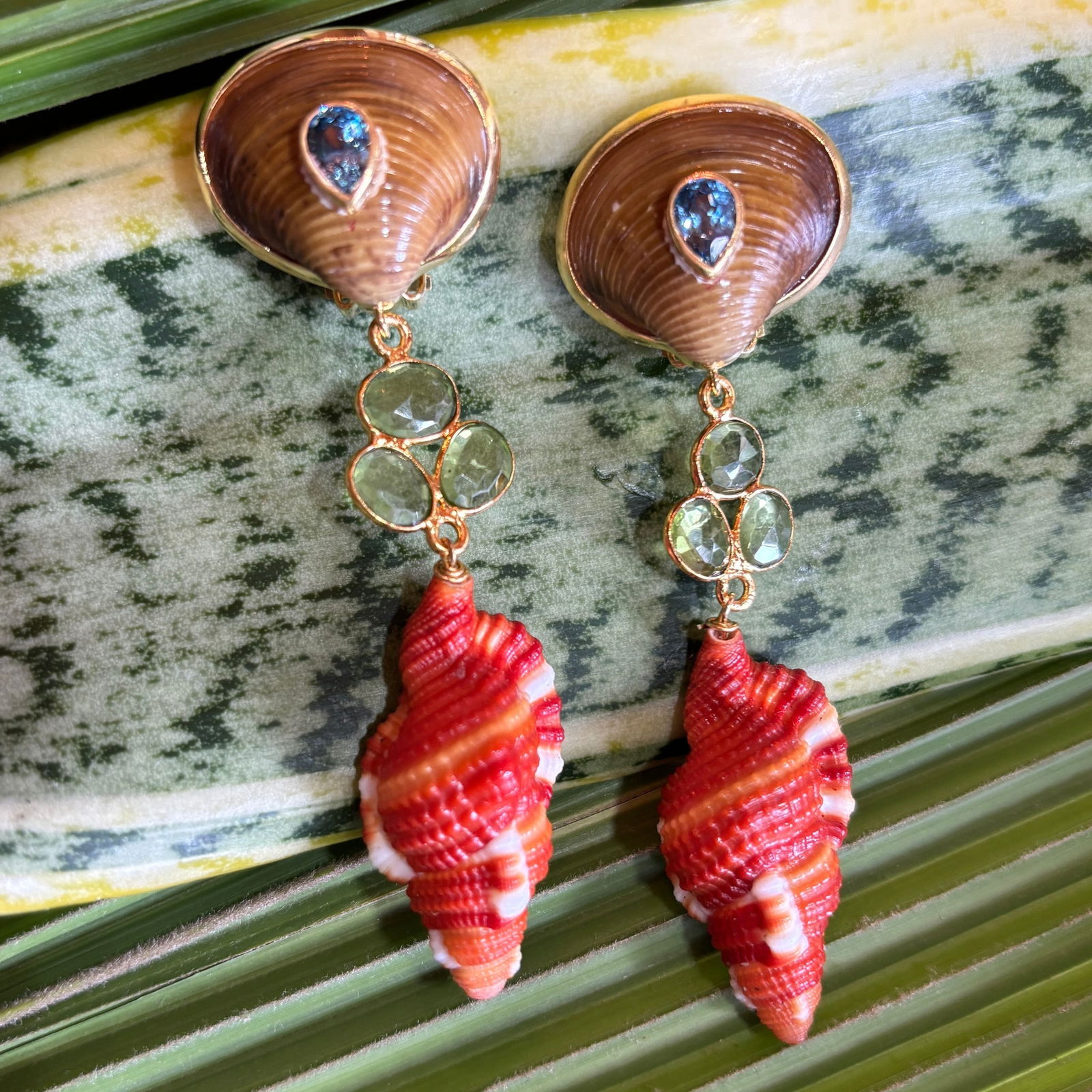 Cymbatium Shell Drop Earrings with Blue Topaz: Title:Cymbatium Shell Drop Earrings with Blue TopazDescription:Brown Scallops set with Blue Topaz, cheery Peridot and specimen Cymbatium Shells - Signed CSS - Vermeil - 2.75" Drop - Post/Clip Back 