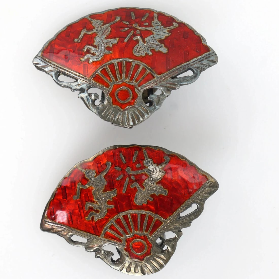 1960s Thai Silver Clip Earrings with Niello: Title:1960s Thai Silver Clip Earrings with Niello Size:1 in wide Description:A pair of rectangular silver clip earrings with a Thai dancer surrounded by black niello work. Both are marked “Siam